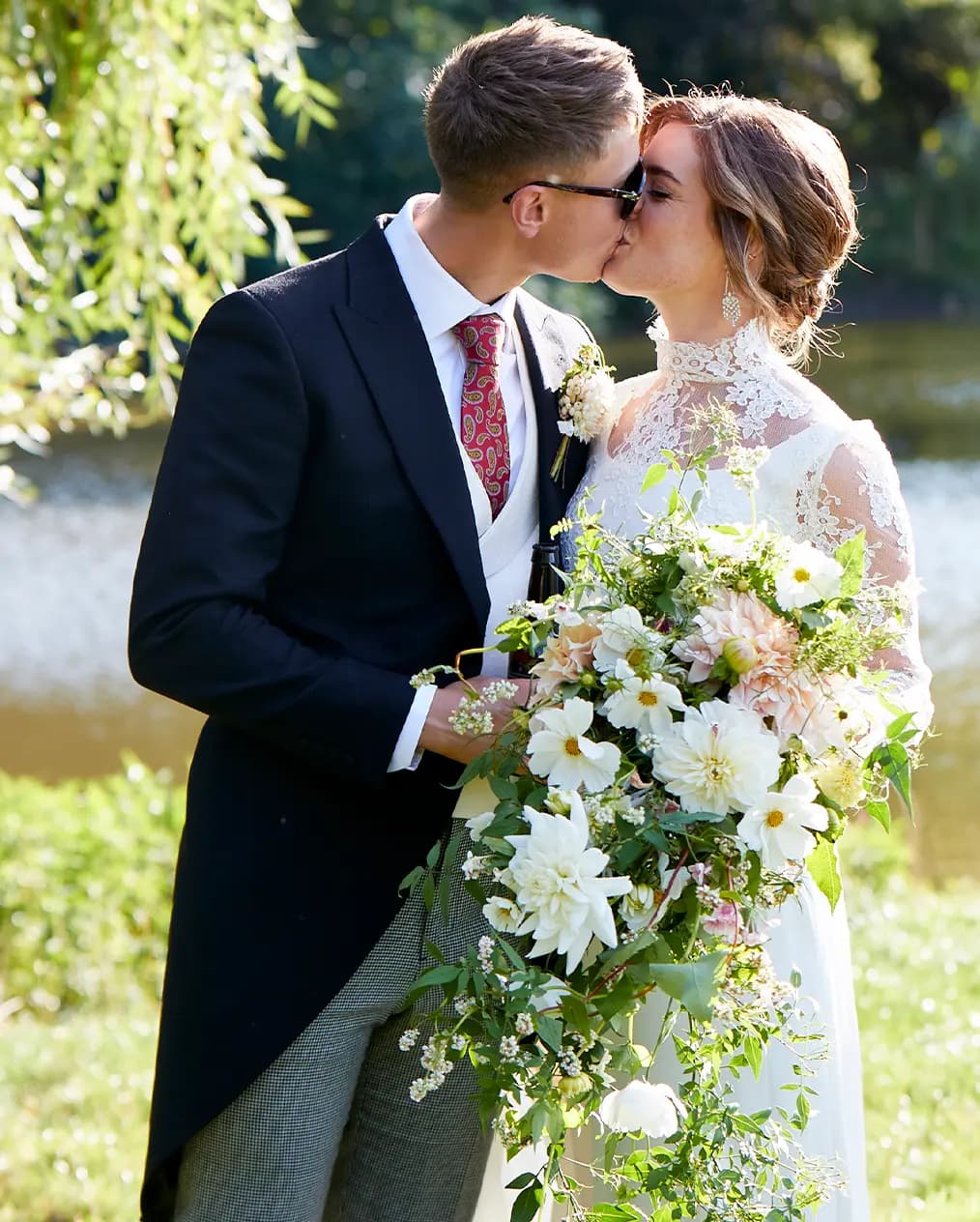 bride and groom sharing a romantic kiss