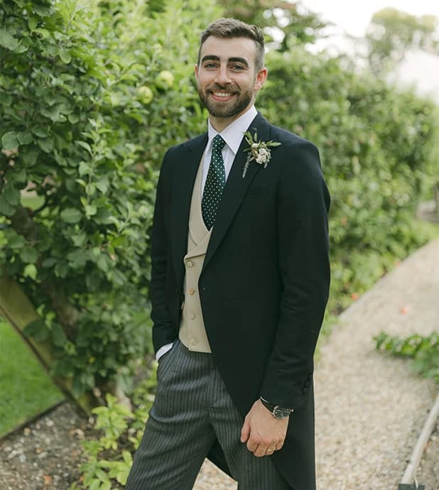 A stylish groom wears traditional morning suit from Favourbrook