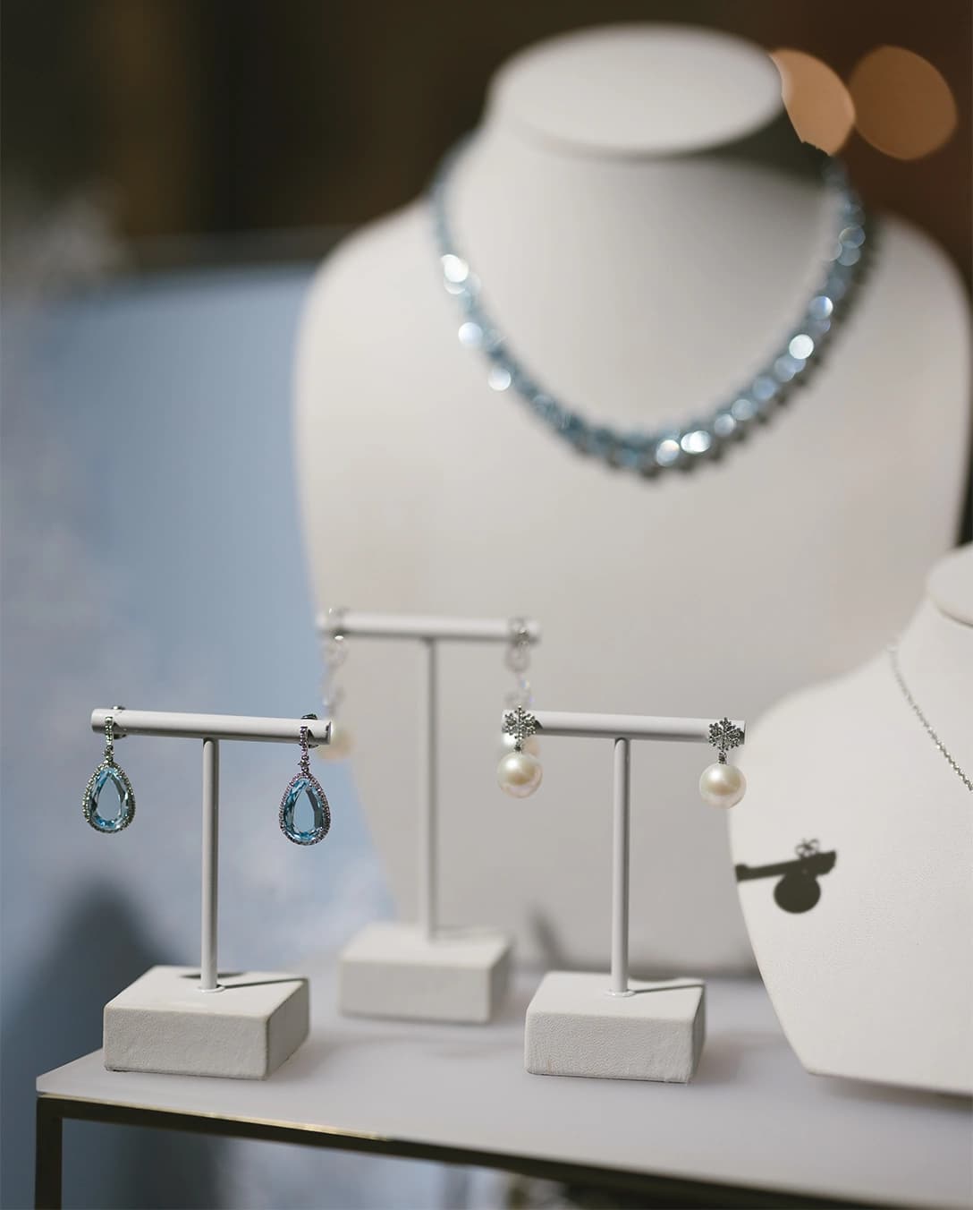 A showcase of Kiki McDonough pale blue bridal jewellery in The Wedding Present Company showroom