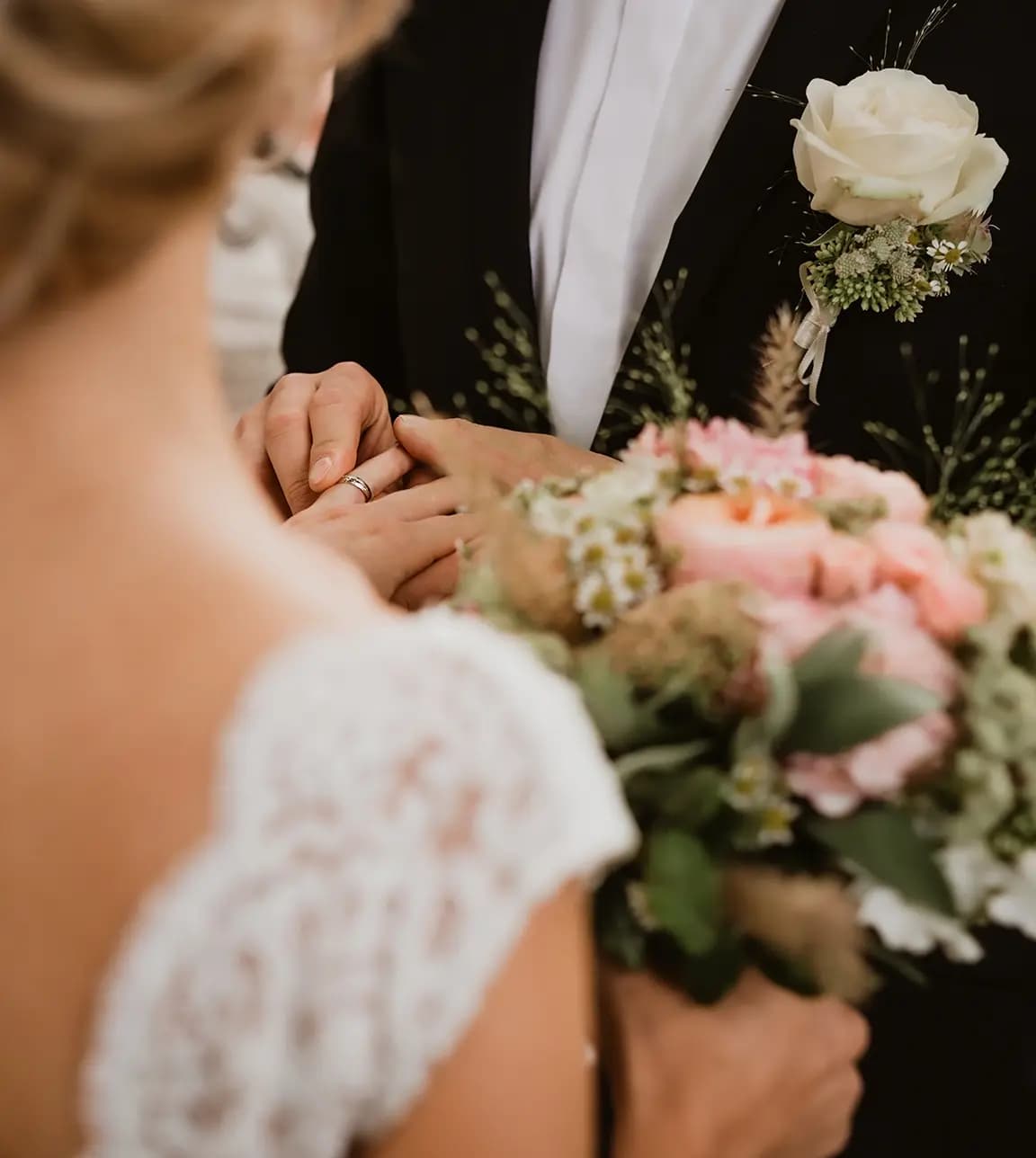 Bride and groom exchange rings